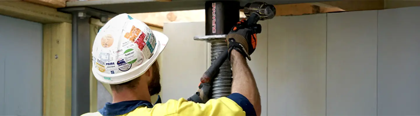 Man installing hydraulic jacking