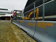 Safety barriers set up at a construction site to protect workers, manage traffic flow, and secure the work zone.