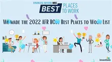 A diverse group of employees smiling and collaborating in a bright, modern office, illustrating a positive and happy workplace.