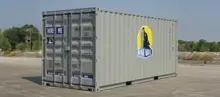 A 20ft grey shipping container with Royal Wolf branding placed in an outdoor industrial setting.