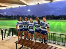 Group of athletes proudly posing in their sponsored uniforms, representing team spirit and brand partnership.