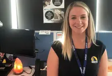 Customer Centre Manager in her office, coordinating site safety support and managing inquiries about barrier installations.